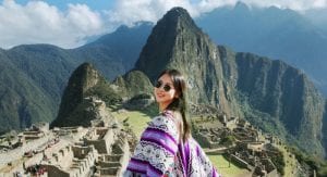 woman posing in front Machu Picchu