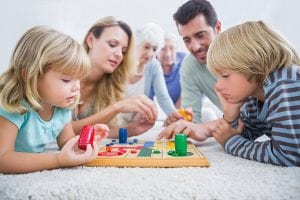 a family enjoying their time playing a board game